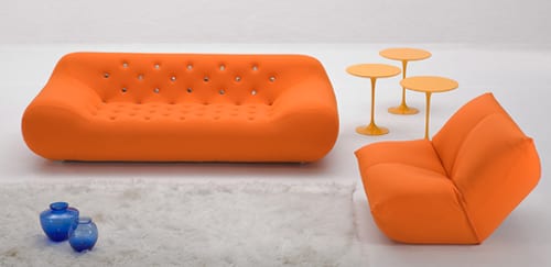 orange tufted couch
