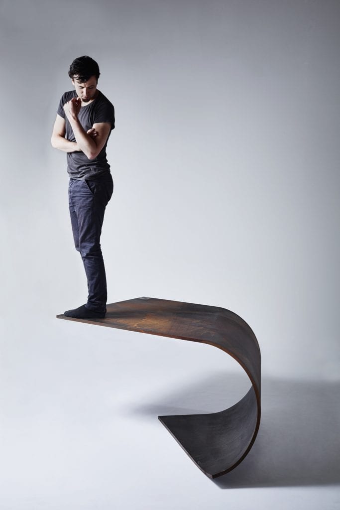A Balanced Sheet of Steel: The Poised Table