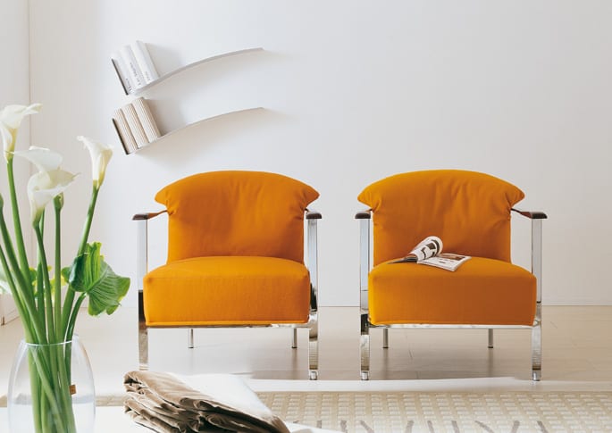 modern armchair with feather back pillow