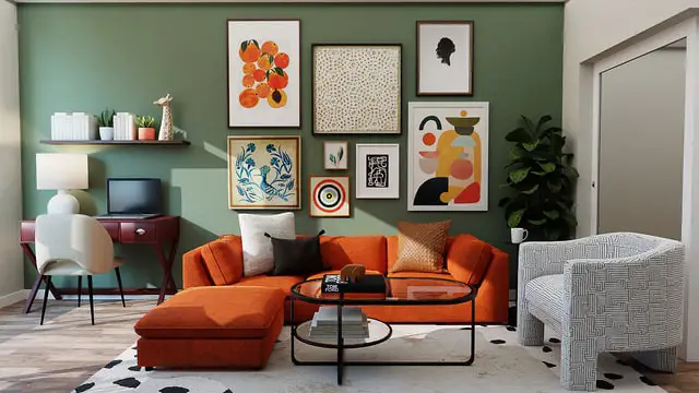 A living room with a brown sofa in the middle and green walls and several paintings on it